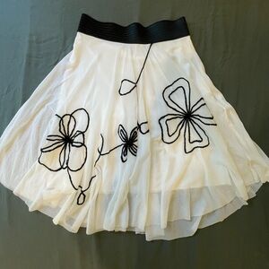 Elegant White Midi Skirt with Black Floral Accents